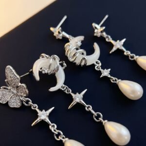 bijoux-3728-macro-1.jpg Boucles Asymétriques Étoile et Lune Enroulées